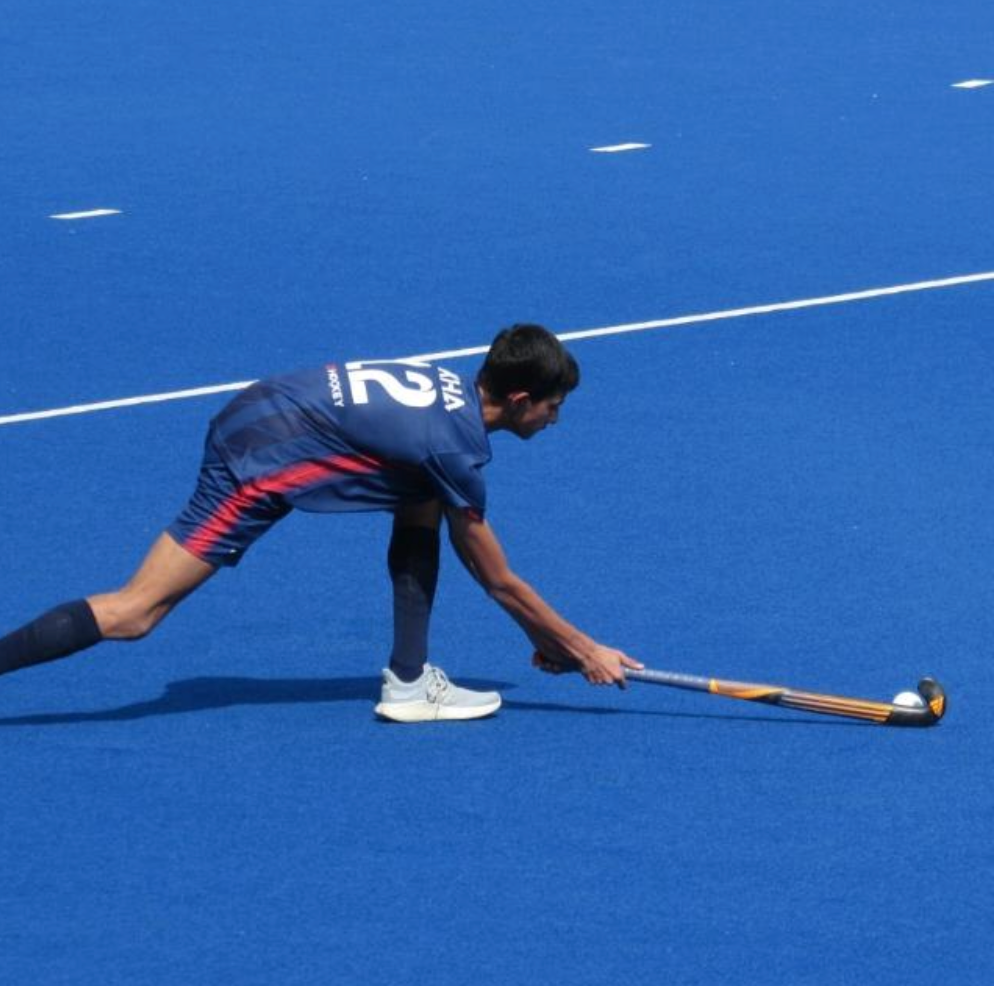 Adhit Ranjan in hockey leading his school's senior team